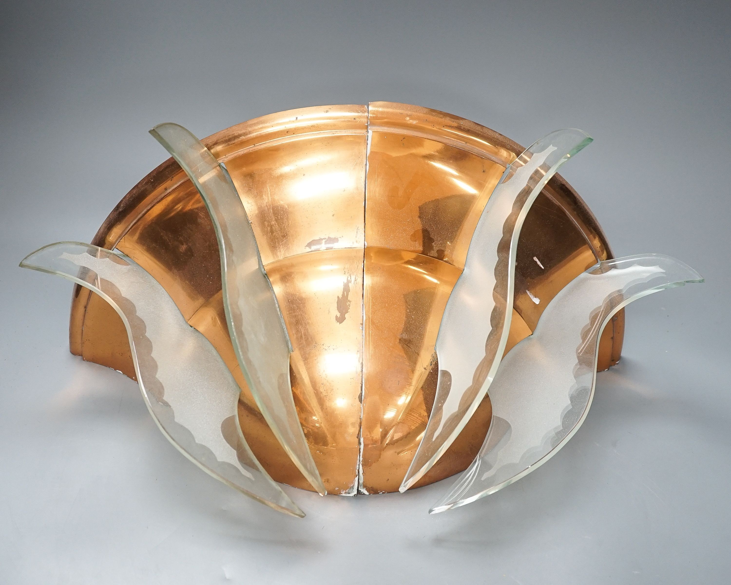 A pair of copper quarter wall lights